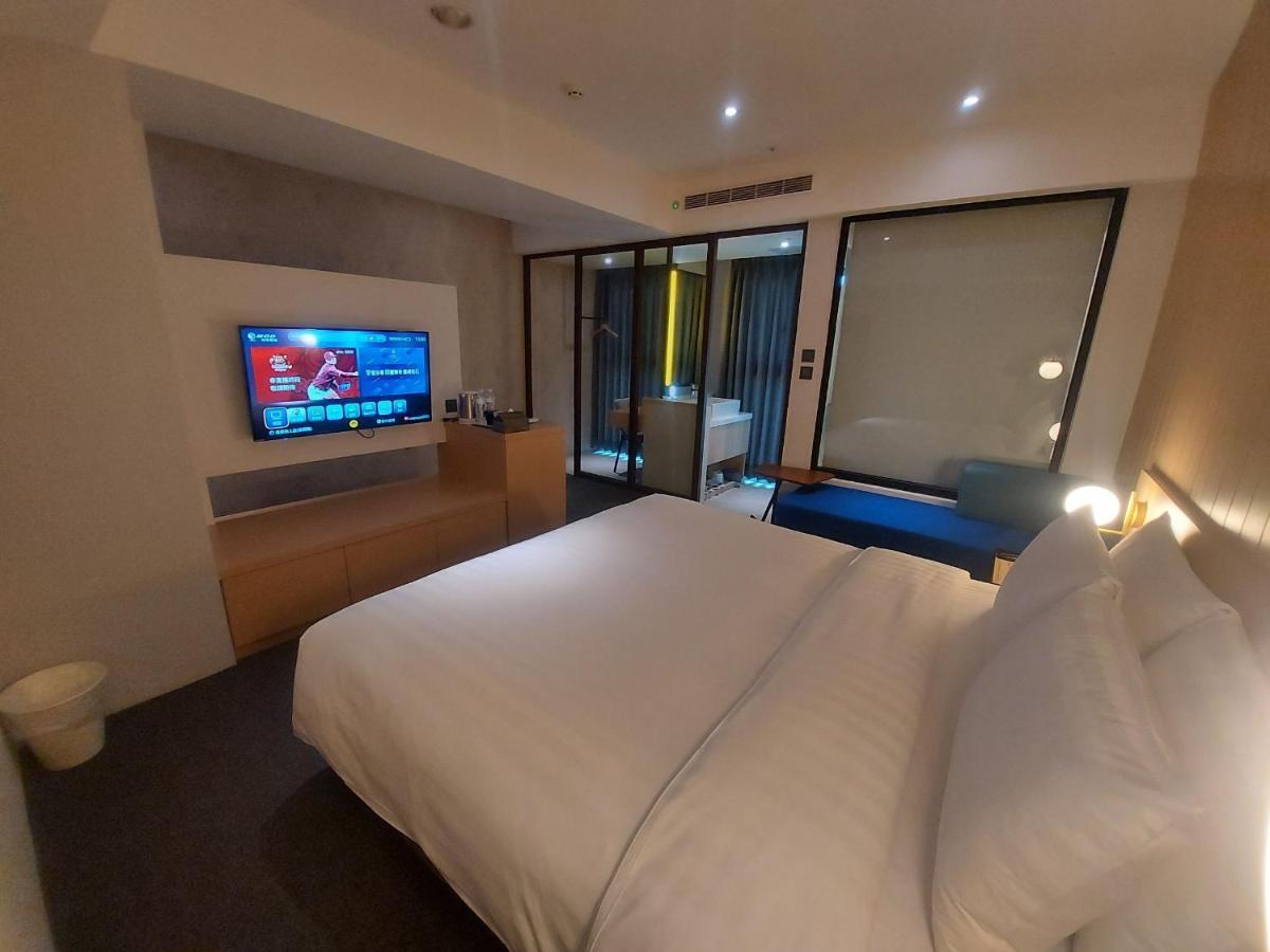 E Hotel Xinshi Bagian luar foto